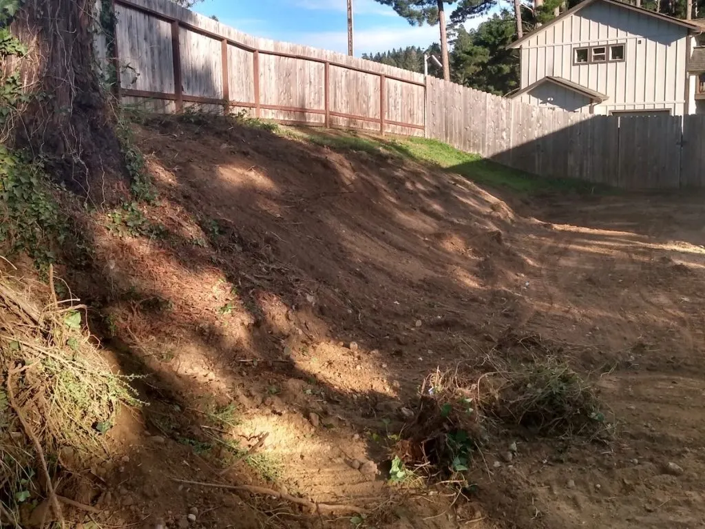 Backyard slope graded to bare dirt before landscaping, Humboldt County