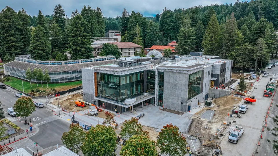 Aerial view of a modern commercial building with new landscaping and site work