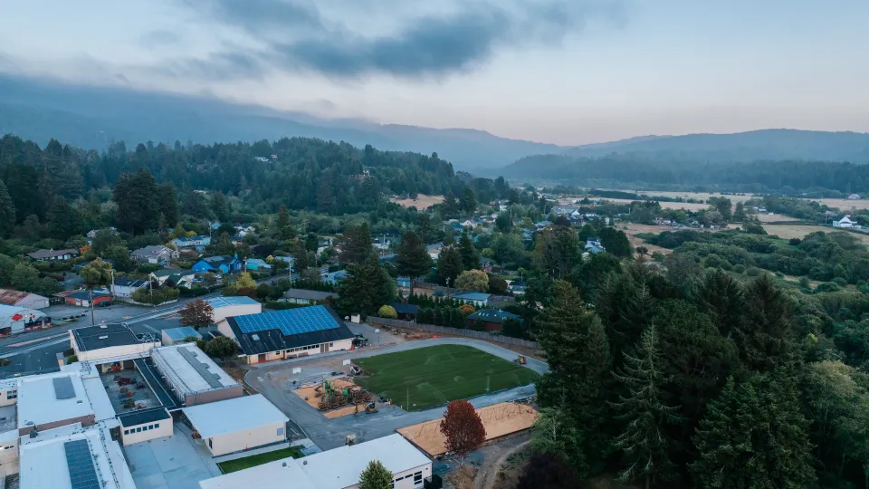 Aerial view of a North Coast campus and the surrounding valley